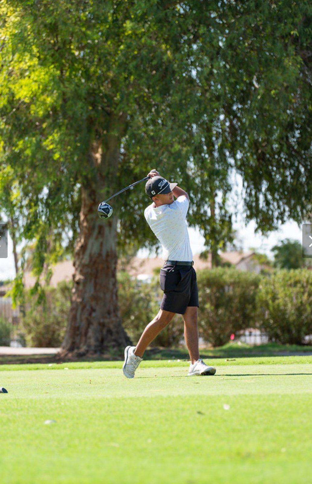 Carter Yanulavich finishing his swing on the course